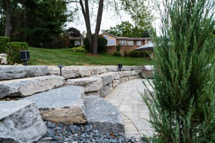 Freshly edged lawn with mulched planting beds at a South Lyon home